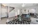 Inviting living room with hardwood floors, modern furniture, and lots of light at 6626 W Laurel Ave, Glendale, AZ 85304
