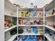 Walk-in pantry with shelving, great for organized storage of kitchen staples at 6626 W Laurel Ave, Glendale, AZ 85304