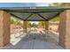 Shaded community picnic area with tables and play equipment that provides children with a fun and safe place to play at 6626 W Laurel Ave, Glendale, AZ 85304