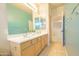 Well-lit bathroom featuring a double sink vanity and tile flooring at 6778 W Lariat Ln, Peoria, AZ 85383