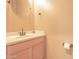 Bright bathroom featuring a vanity with a white countertop and a neutral color palette at 6778 W Lariat Ln, Peoria, AZ 85383