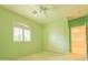 Bright bedroom with a ceiling fan, window with shutters, and a closet at 6778 W Lariat Ln, Peoria, AZ 85383