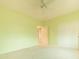 Bedroom with neutral carpet, painted walls, and ceiling fan, with a view to the hallway at 6778 W Lariat Ln, Peoria, AZ 85383