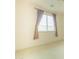 Bedroom featuring neutral carpet, window with blinds, and curtains at 6778 W Lariat Ln, Peoria, AZ 85383