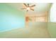Large carpeted bonus room with natural light and neutral paint at 6778 W Lariat Ln, Peoria, AZ 85383