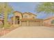 Inviting two-story home with a three-car garage and low-maintenance desert landscaping at 6778 W Lariat Ln, Peoria, AZ 85383