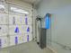 Garage featuring paneled door insulation, water softener, and other mechanicals at 6778 W Lariat Ln, Peoria, AZ 85383