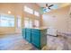 Open kitchen featuring an island with granite countertops and an open floor plan with high ceilings at 6778 W Lariat Ln, Peoria, AZ 85383