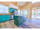 Modern kitchen with an island, stainless steel appliances, and sleek cabinetry at 6778 W Lariat Ln, Peoria, AZ 85383