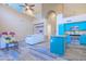 Bright living room showcasing a high ceiling, granite countertops, blue cabinets, and an open floor plan at 6778 W Lariat Ln, Peoria, AZ 85383