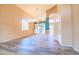 Large open-concept living space with shutters, high ceilings, and stylish wood-look flooring at 6778 W Lariat Ln, Peoria, AZ 85383