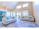 Bright living room featuring an open floor plan, natural light, and wood-style floors at 6778 W Lariat Ln, Peoria, AZ 85383