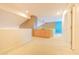 Open loft area with built-in storage and view to a bright blue accent wall at 6778 W Lariat Ln, Peoria, AZ 85383