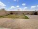 A large brick patio and lawn in a cozy backyard setting at 7215 N 123Rd Dr, Glendale, AZ 85307