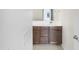 Bathroom featuring a dark wood vanity and a white countertop at 7215 N 123Rd Dr, Glendale, AZ 85307