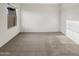Cozy bedroom featuring neutral carpet and a window for natural light at 7215 N 123Rd Dr, Glendale, AZ 85307