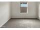 Bright bedroom featuring neutral carpet and a window for natural light at 7215 N 123Rd Dr, Glendale, AZ 85307