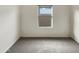 Neutral bedroom with carpet and window, ready for your personal touch at 7215 N 123Rd Dr, Glendale, AZ 85307