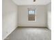 Bright bedroom featuring neutral carpet and a window for natural light at 7215 N 123Rd Dr, Glendale, AZ 85307