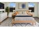 Bright bedroom featuring neutral walls, modern decor, large windows, and natural light at 7215 N 123Rd Dr, Glendale, AZ 85307