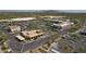 Bird's eye view of the neighborhood shopping center with parking and surrounding desert landscape against a mountain backdrop at 7216 E Aurora --, Scottsdale, AZ 85266