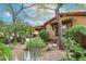Charming backyard with mature landscaping, a covered patio with a grill, and lovely desert surroundings at 7216 E Aurora --, Scottsdale, AZ 85266