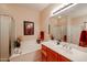 Bright bathroom features a soaking tub, framed art, and modern fixtures at 7216 E Aurora --, Scottsdale, AZ 85266