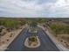 Aerial view of the community entrance, featuring landscaped medians and a secure gate at 7216 E Aurora --, Scottsdale, AZ 85266