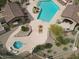 Overhead aerial view of community pool and spa area with lounge chairs, tables, and desert landscaping at 7216 E Aurora --, Scottsdale, AZ 85266