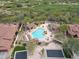 Aerial view of the community pool and spa area, surrounded by lounge chairs, cabanas, and desert landscaping at 7216 E Aurora --, Scottsdale, AZ 85266
