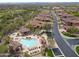 Aerial view of the community pool, cabanas, lounge seating, and surrounding homes, offering a resort-style experience at 7216 E Aurora --, Scottsdale, AZ 85266