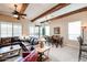 Open-concept living and dining area featuring exposed beams, modern furnishings, and natural light at 7216 E Aurora --, Scottsdale, AZ 85266