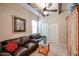 Comfortable living room with leather sofas, ceiling fan, and wood accents at 7216 E Aurora --, Scottsdale, AZ 85266