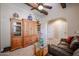 Living area with wooden cabinets, stylish decor, and tiled entryway at 7216 E Aurora --, Scottsdale, AZ 85266