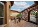 Private brick patio featuring wrought iron furniture and gate at 7216 E Aurora --, Scottsdale, AZ 85266
