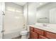 Bathroom featuring a shower-tub combo, single vanity and tile flooring at 7622 S 69Th Dr, Laveen, AZ 85339