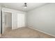 This bedroom features neutral walls, carpet flooring and a double-door closet at 7622 S 69Th Dr, Laveen, AZ 85339