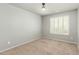 Bright bedroom with neutral walls features plantation shutters for adjustable natural light at 7622 S 69Th Dr, Laveen, AZ 85339