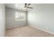 Bright bedroom with neutral walls features plantation shutters for adjustable natural light at 7622 S 69Th Dr, Laveen, AZ 85339