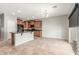 Open kitchen and dining area with brown cabinets, black appliances and tile flooring at 7622 S 69Th Dr, Laveen, AZ 85339