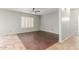 Bright room with wood and tiled floors and a plantation shutter window at 7622 S 69Th Dr, Laveen, AZ 85339