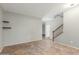 Bright room with tiled floors and a staircase with wood rails at 7622 S 69Th Dr, Laveen, AZ 85339