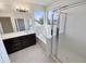 Bright bathroom with a double vanity, separate shower and soaking tub, and tile flooring at 7924 S 70Th Ln, Laveen, AZ 85339