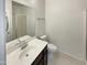 Well-lit bathroom featuring a single vanity, toilet and shower at 7924 S 70Th Ln, Laveen, AZ 85339