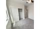Bedroom featuring carpeting and a closet with bi-fold doors at 7924 S 70Th Ln, Laveen, AZ 85339