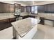 Updated kitchen with stainless steel appliances, granite countertops, and center island at 7924 S 70Th Ln, Laveen, AZ 85339