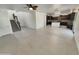 Bright, open-concept living area with tile floors, an eat-in kitchen and staircase at 7924 S 70Th Ln, Laveen, AZ 85339