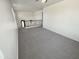 Loft featuring plush carpet, neutral walls, and wrought iron banister at 7924 S 70Th Ln, Laveen, AZ 85339