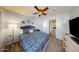 Charming bedroom featuring a ceiling fan and an open doorway, creating a comfortable and inviting space at 7971 W Montebello Ave, Glendale, AZ 85303