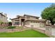 Beautiful two-story home featuring a three-car garage and well-manicured lawn at 7971 W Montebello Ave, Glendale, AZ 85303